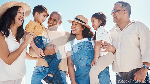 Image of Children, beach and summer with a black family together outdoor on the sand by the ocean or sea for holiday. Kids, love or nature with siblings, parents and grandparents bonding outside on the coast