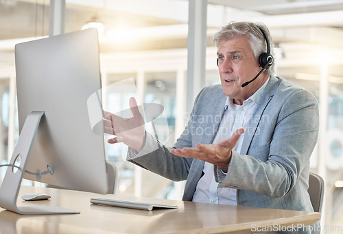 Image of Frustrated, confused and stress in call center, man with headset and contact us, CRM problem and computer glitch. Mature male employee, tech support mistake or software error in customer service