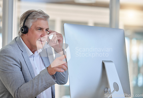 Image of Call center, advice and senior man at computer with headset in consulting in customer service office . Ceo, insurance sales and mature businessman at advisory agency, contact us and crm networking.