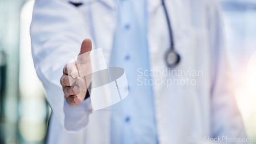 Image of Doctor, handshake and greeting hand gesture to welcome, onboarding and partnership by medical worker in hospital. Closeup, one and person or healthcare professional offer agreement for interview