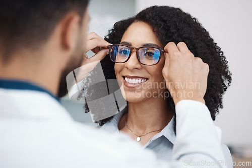 Image of Glasses, vision and optometry with a black woman customer in an optician office for consulting. Eyewear, frame and frame with a doctor or consultant helping a female patient to correct eyesight