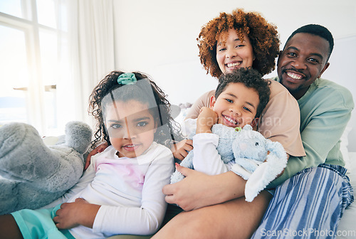 Image of Big family, portrait and bedroom with a mom, dad and children together in morning. Group hug, happiness and smile in a house with parent love, support and bonding with kids, mom and father at home