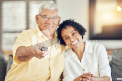 Image of Portrait of senior couple watching tv on sofa with comedy show, film or movies at home together with love and hug. Biracial people or woman with elderly partner watch television and relaxing on couch