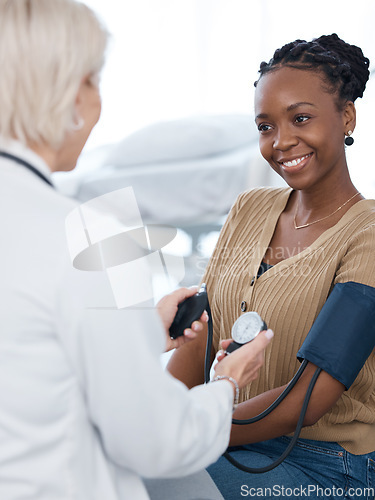 Image of Blood pressure, doctor and black woman patient smile in hospital for healthcare consulting services. Clinic worker check arm hypertension, diabetes test and heart wellness for healing surgery results
