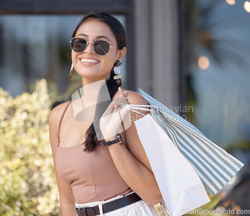 Image of Woman with shopping bag, outdoor market and retail, fashion and happy customer with freedom in city. Luxury with sale, discount and deal at boutique, female with smile for store product and commerce