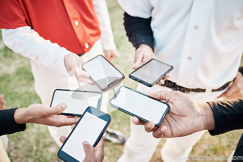 Image of Hands, phone and communication with a baseball team outdoor on a sport field for strategy or tactics before a game. Teamwork, fitness and networking with a group of people sharing sports information