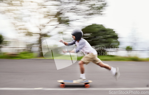 Image of Skateboard, motion blur and man speed on road for sports competition, training and exercise in city. Skating, skateboarding and male skater ride for adrenaline, adventure and freedom for challenge