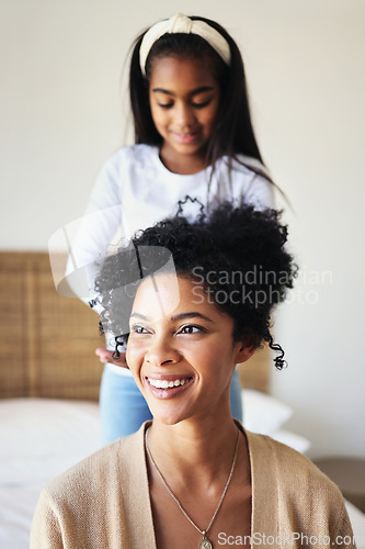 Image of Daughter or child brushing mother hair and bonding in a home bedroom smile, adorable and happy together. Single mom, kid and mum relax spending quality time grooming in a house in happiness