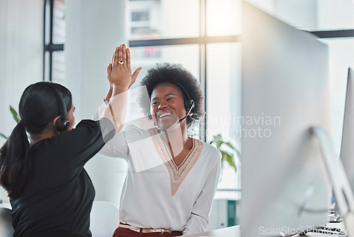 Image of Telemarketing, high five and women with success, customer service and achievement in workplace. Female employees, consultants and agents in office, celebration for target or happiness with motivation