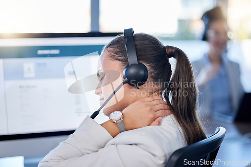 Image of Stress, neck pain or woman in call center with burnout, fatigue or bad ache at customer services. Posture problem, muscle tension injury or tired sales consultant in telemarketing or communications