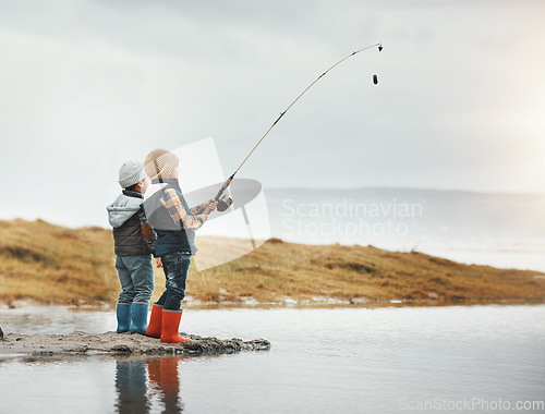 Image of Lake, activity and children fishing while on vacation, adventure or weekend trip for a hobby. Outdoor, nature and boy siblings or kids catching fish in water together while on holiday in countryside.