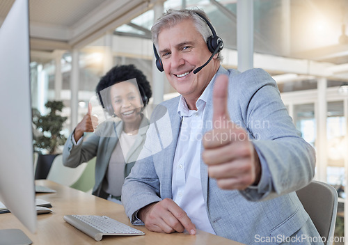 Image of Customer support, thumbs up and portrait of call center employees happy at computer in consulting office. Help desk, smile and mature man with black woman at advisory agency for crm networking online