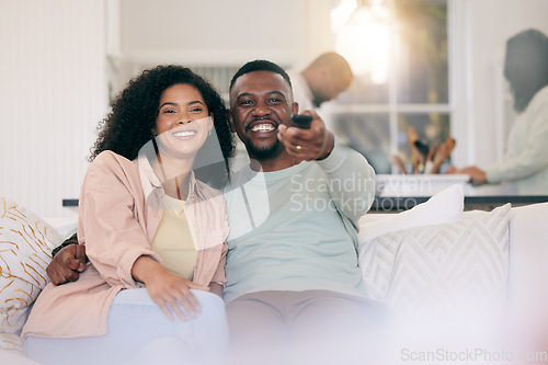 Image of Black couple on couch, watching television and remote with smile, quality time and bonding together. Love, African American man and happy woman on sofa, tv for movie and happiness to relax in lounge