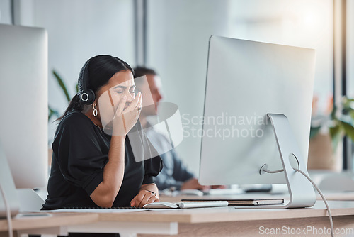 Image of Crm, yawn and business woman in a call center office on a web help consultation. Telemarketing, customer support and employee feeling tired, fatigue and burnout from consultant job and networking