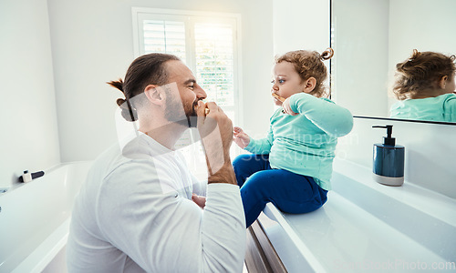 Image of Family, children or brushing teeth with a father and girl in the bathroom of their home together or dental hygiene. Kids, teaching or oral with man and female child bonding while mouth cleaning