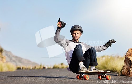 Image of Skateboard, slide and man in road for sports competition, fitness training and exercise on mountain. Skating, skateboarding and male skater riding for speed, adventure and freedom for sport challenge