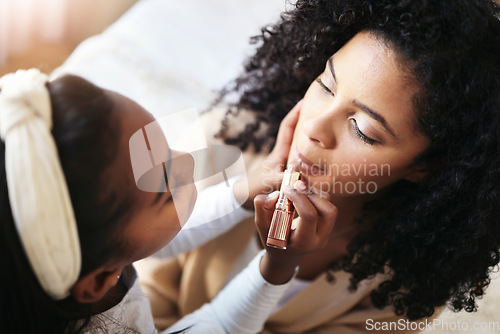 Image of Playing, helping and mother and child with makeup, applying lipstick and cosmetics. Above, help and girl with application of a cosmetic product with mom for fun, bonding or quality time together