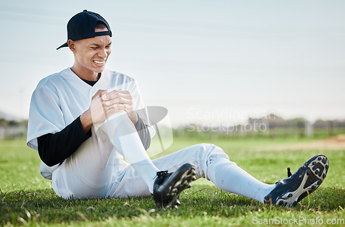 Image of Baseball, pain and man with knee injury on field after accident, fall or workout in match. Sports, training and male athlete with fibromyalgia, inflammation or broken leg, arthritis or tendinitis.