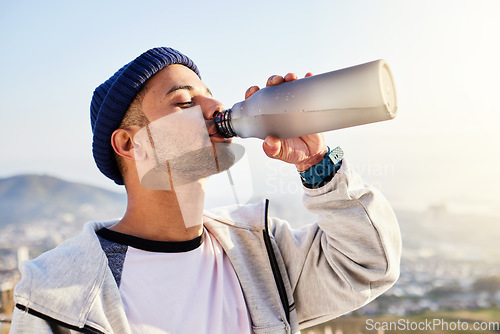 Image of Man drinking water, runner in city with fitness and health, thirsty and hygiene with satisfaction and break from running outdoor. Bottle, h2o and eyes closed with young male, urban and exercise