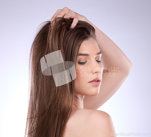 Image of Face, beauty and hair care of woman in studio isolated on a gray background. Skincare, makeup cosmetics and female model with salon treatment for healthy keratin, balayage or natural hairstyle growth