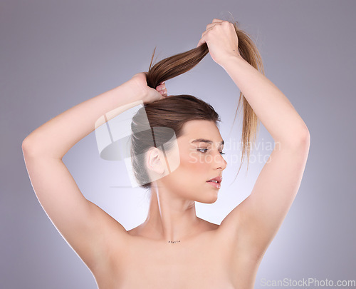 Image of Thinking, beauty and hair care of a woman in studio isolated on a gray background. Cosmetics, growth and female model with salon treatment for healthy keratin, balayage texture or long hairstyle pull