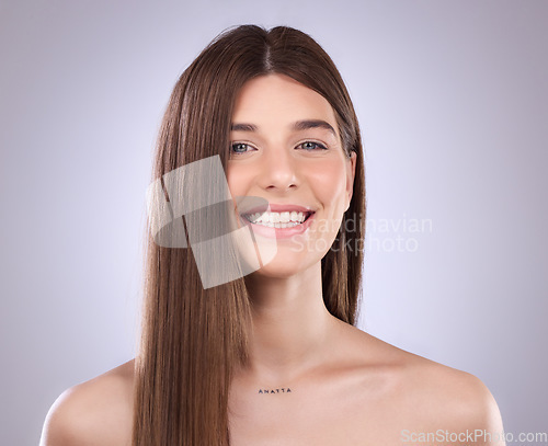 Image of Beauty, face portrait and hair care of woman in studio isolated on a gray background. Natural cosmetics, smile and happy female model with salon treatment for healthy keratin, balayage and hairstyle.