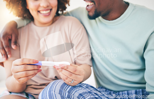 Image of Happy, couple and pregnancy test, smile and excited for good news, positive and results in their house. Hands, woman and man with home testing kit, pregnant and fertility or ivf success while hugging