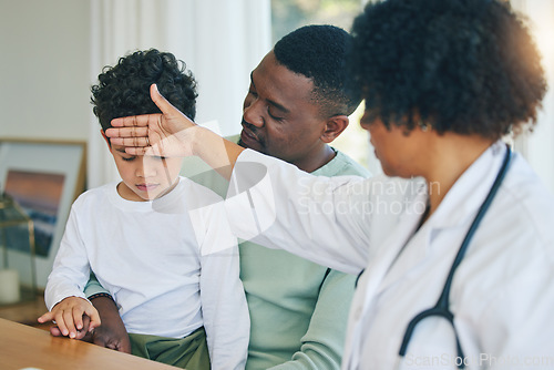 Image of Pediatrician, woman doctor and sick child with father in a hospital and clinic checking fever. Illness, kid and dad supporting a boy feeling virus and flu with a healthcare and wellness worker