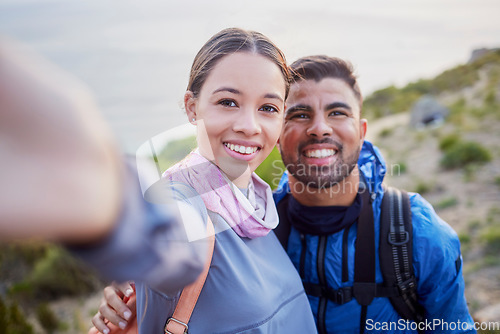 Image of Man, woman and hiking selfie portrait with love, happiness and nature for outdoor adventure on holiday. Young happy couple, blog and mountain for care, bonding and vacation with social network