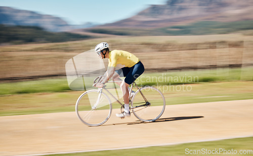 Image of Man cycling with blurred background speed in nature, countryside and training for triathlon, sports and power. Cyclist, bicycle and motion of bike for fitness, energy and exercise performance on path