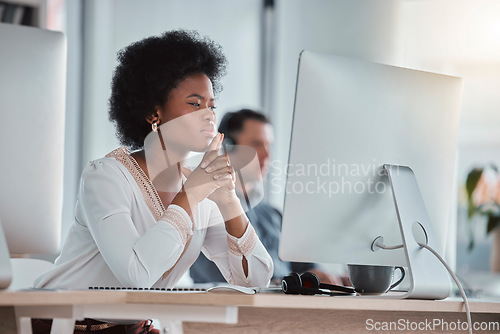 Image of Thinking, focus or black woman on computer in office for online project, proposal or planning digital ideas. Concentration or thoughtful worker working on pc for internet, network or website research