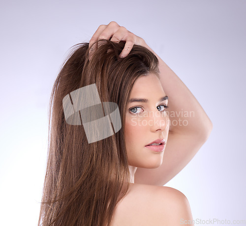 Image of Face portrait, beauty and hair care of woman in studio isolated on a gray background. Skincare, makeup cosmetics or female model with salon treatment for healthy keratin, balayage or hairstyle growth