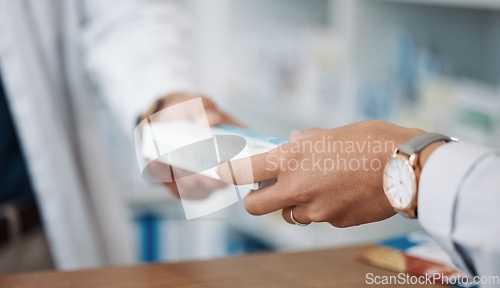 Image of Closeup, hands and prescription with customer, pharmacist and medicine in drug store. Zoom, hand and medication in clinic, pills and pharmacy for medical antibiotics product, healthcare and wellness