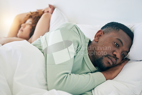 Image of Bedroom, couple conflict and sad black man in morning after fighting, argument and relationship problem. Depression, dating and male in bed with woman with sexual frustrated, infertility and stress