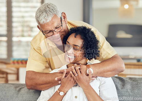 Image of Love, relax and senior couple hug, care and enjoy quality bonding time on home living room sofa. Retirement happiness, marriage smile and romantic elderly husband, wife or people happy together