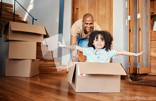 Image of Box, fun and child with father in living room celebrating moving day, rental or real estate. Property, home and boy with parent, cardboard or airplane game while packing for relocating or new house