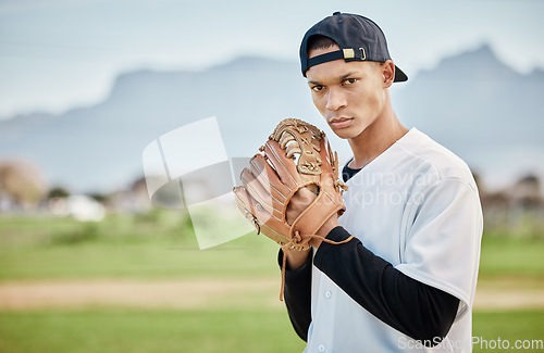 Image of Portrait pitcher, baseball player or man training for a sports game on outdoor field stadium. Fitness, motivation or focused athlete pitching or throwing a ball with a glove in workout or exercise