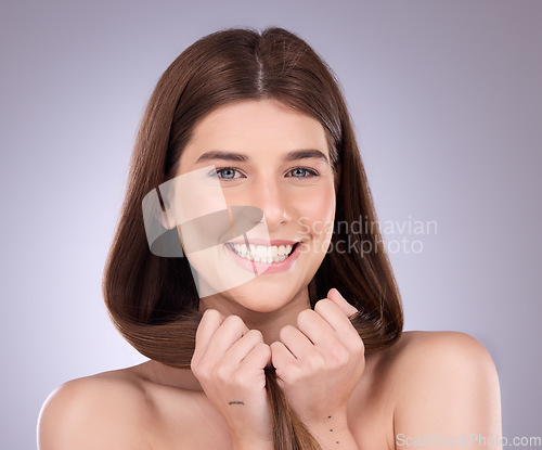 Image of Face portrait, smile and hair care of a woman in studio isolated on a background. Cosmetics, growth and beauty of female model with salon treatment for healthy keratin, balayage and lone hairstyle.
