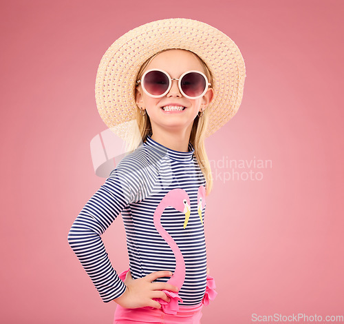Image of Vacation, portrait of child with sunglasses and hat in studio with fun clothes isolated on pink background. Summer, holiday and fashion, happy girl in Australia excited for travel with smile on face.