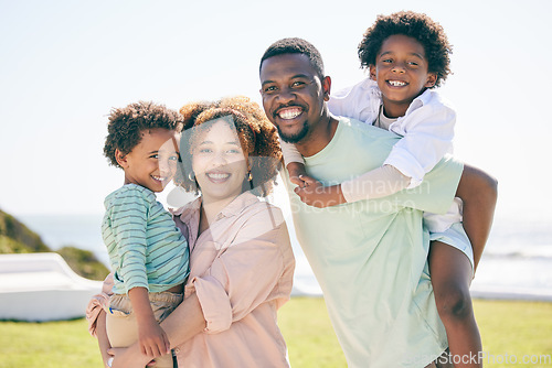 Image of Happy, smile and portrait of a black family at beach for travel, vacation and piggyback on nature background. Relax, face and trip with children and parents embrace and bond while traveling in Miami