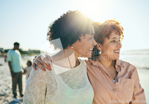 Image of Love, beach and mother with her adult daughter walking by the ocean together while on vacation. Happy, smile and mature woman bonding with her female child by the sea while on holiday or weekend trip