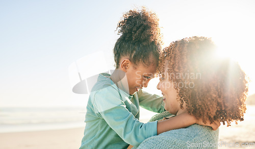 Image of Family, mother and kid hug at beach, travel and summer with sunshine lens flare and together outdoor. Trust, support with woman and girl smile on vacation, love and care in nature with happiness