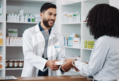 Image of Man, pharmacist and medication consulting customer at counter for prescription drugs or medicine at the clinic. Male doctor giving patient medical antibiotics at the pharmacy for healthcare wellness