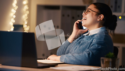 Image of Business woman, phone call and laughing in office at night, chatting or speaking to contact. Bokeh, overtime or happy female employee with mobile smartphone for funny conversation or comic discussion