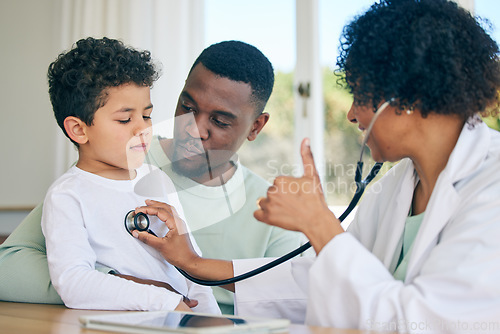 Image of African dad, pediatrician with stethoscope and child in doctors office for health checkup on heart, lungs and breathing. Black man, son and woman doctor with thumbs up or good results in healthcare.