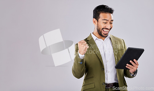 Image of Businessman, tablet or success fist on isolated studio background for financial growth, stock market deal or mock up security. Smile, happy or cheering asian man with winner hands, technology or loan