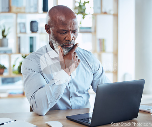 Image of Thinking, business and black man on laptop in office, desk and company for solution, research or strategy. Confused, decision and working on computer of online planning, serious and question ideas