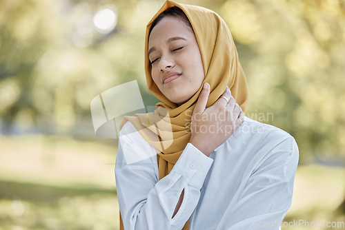 Image of Health, neck pain and Islamic woman outdoor, injury and muscle tension in nature. Muslim female, lady and body ache in park, fatigue and frustrated with inflammation, bruise and first aid problem