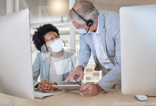 Image of Covid, black woman and man with tablet at call center with mask coaching and helping at help desk. Compliance, consulting and opinion, crm data for medical advisory agency with diversity and support.