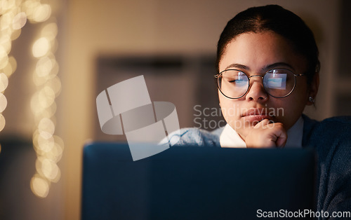 Image of Woman, thinking or reading laptop in night office for growth planning, finance investment or risk management solution. Serious, concentration or working late student on technology with mock up ideas